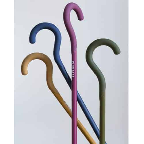 Image shows 4 brightly-coloured canes (yellow, blue, pink and green) with stylised-hooked handles, upright but at various angles, on a white background.